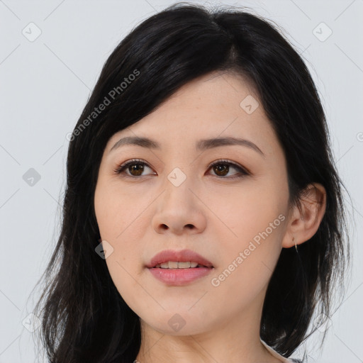 Joyful asian young-adult female with long  black hair and brown eyes