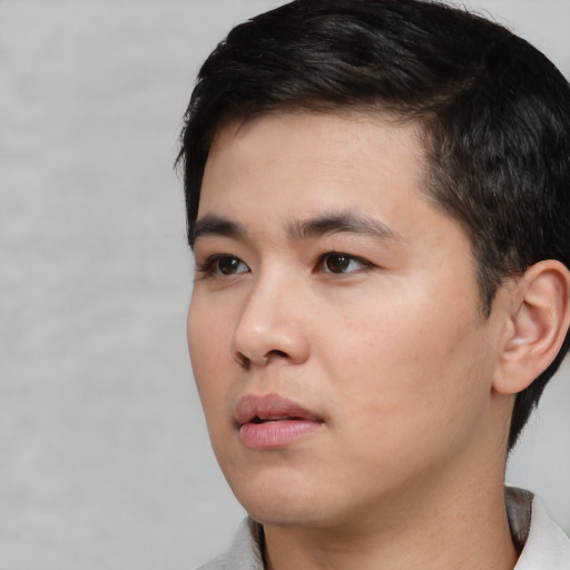 Neutral white young-adult male with short  black hair and brown eyes