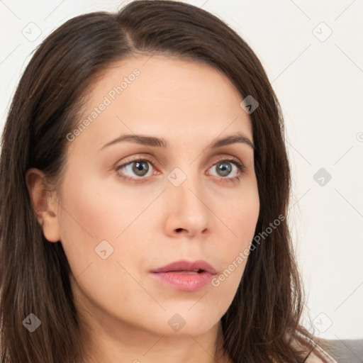 Neutral white young-adult female with long  brown hair and brown eyes