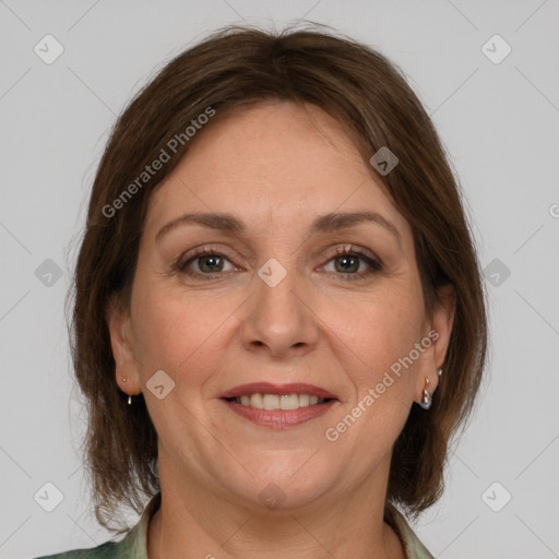 Joyful white adult female with medium  brown hair and grey eyes