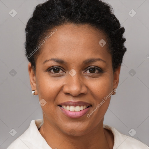 Joyful black young-adult female with short  brown hair and brown eyes