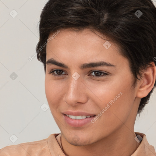 Joyful white young-adult female with short  brown hair and brown eyes