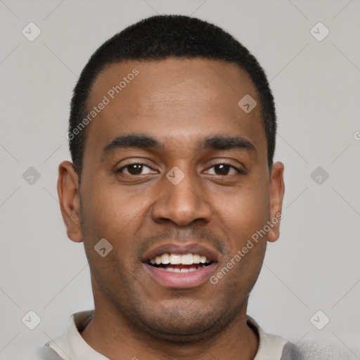 Joyful black young-adult male with short  black hair and brown eyes