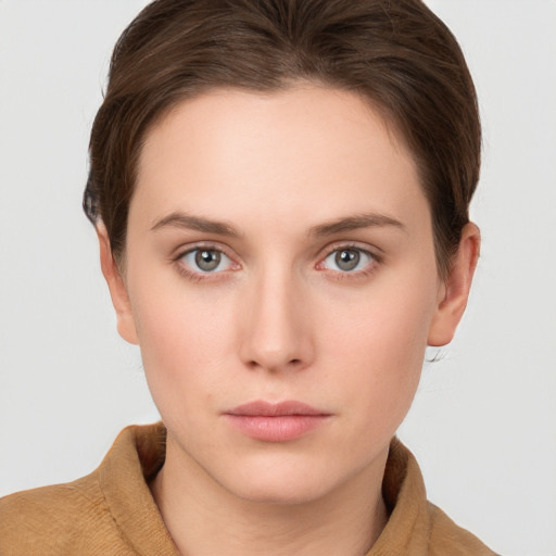 Neutral white young-adult female with short  brown hair and grey eyes