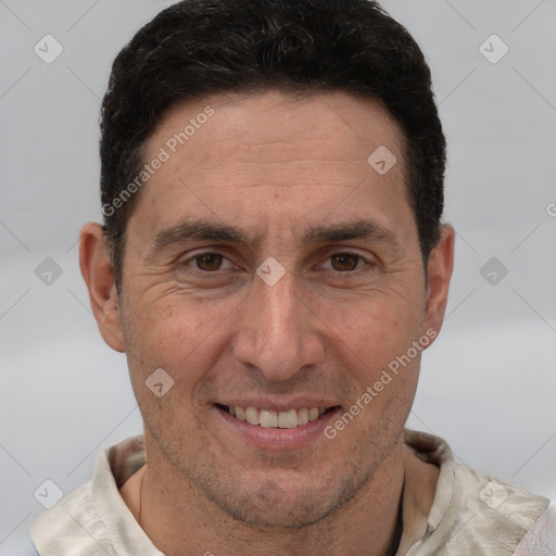 Joyful white adult male with short  brown hair and brown eyes