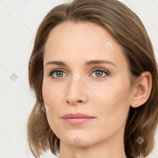 Joyful white young-adult female with long  brown hair and green eyes