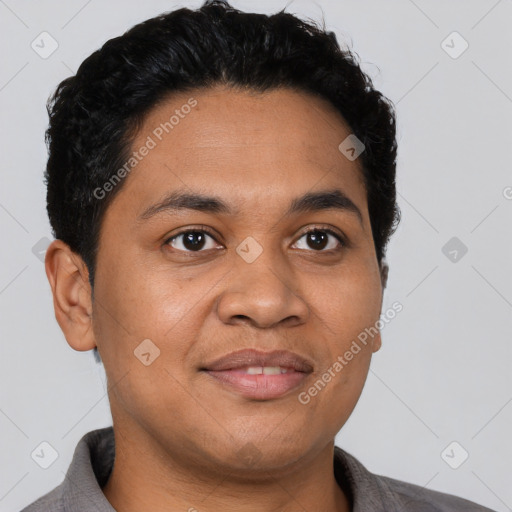 Joyful latino young-adult male with short  black hair and brown eyes