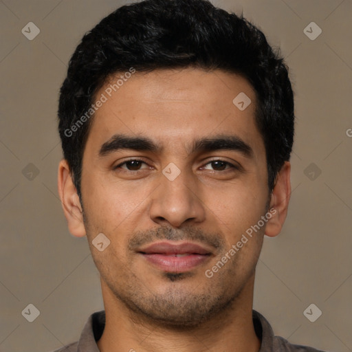 Joyful latino young-adult male with short  black hair and brown eyes