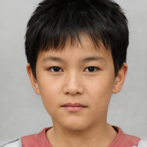 Neutral asian child male with short  brown hair and brown eyes