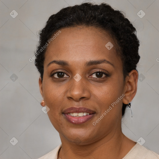 Joyful black adult female with short  brown hair and brown eyes