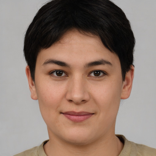 Joyful white young-adult female with short  brown hair and brown eyes