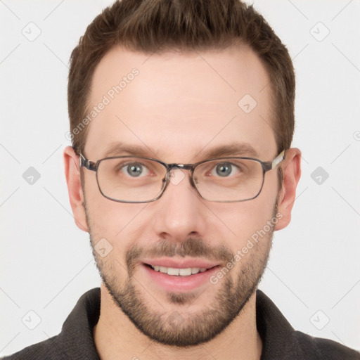 Joyful white young-adult male with short  brown hair and grey eyes