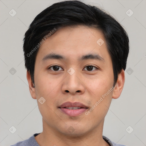 Joyful asian young-adult male with short  black hair and brown eyes