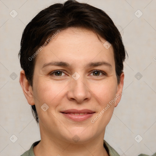 Joyful white young-adult female with short  brown hair and grey eyes