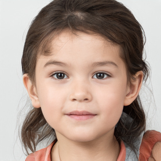 Joyful white child female with medium  brown hair and brown eyes