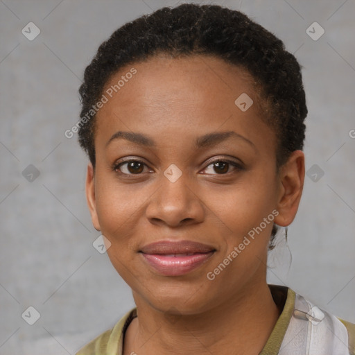 Joyful black young-adult female with short  brown hair and brown eyes