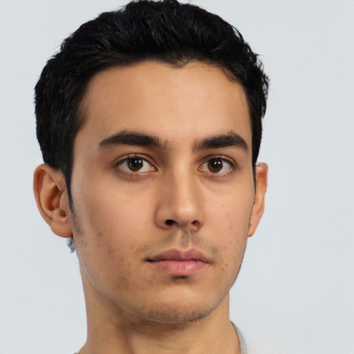 Neutral latino young-adult male with short  black hair and brown eyes