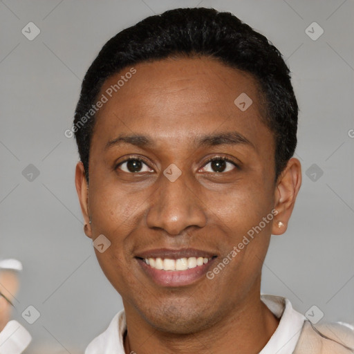 Joyful black young-adult female with short  black hair and brown eyes