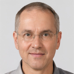 Joyful white middle-aged male with short  brown hair and brown eyes