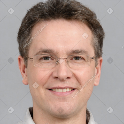 Joyful white adult male with short  brown hair and grey eyes