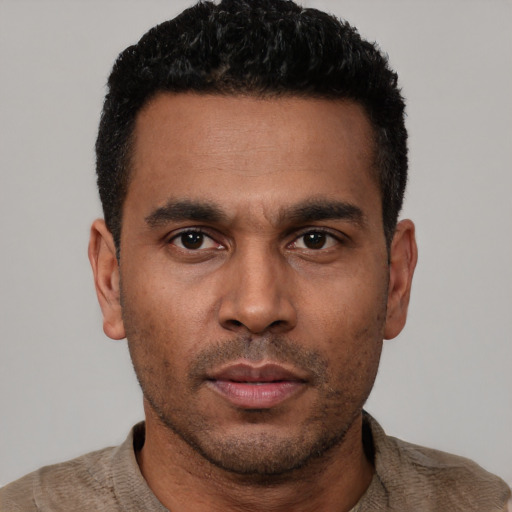 Neutral latino young-adult male with short  black hair and brown eyes
