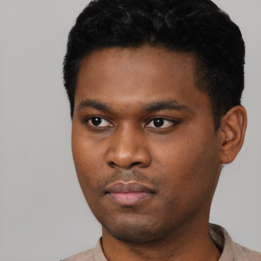 Neutral black young-adult male with short  black hair and brown eyes