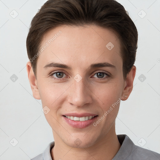 Joyful white young-adult female with short  brown hair and grey eyes