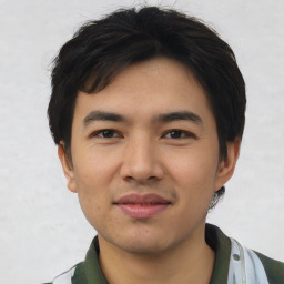 Joyful asian young-adult male with short  black hair and brown eyes