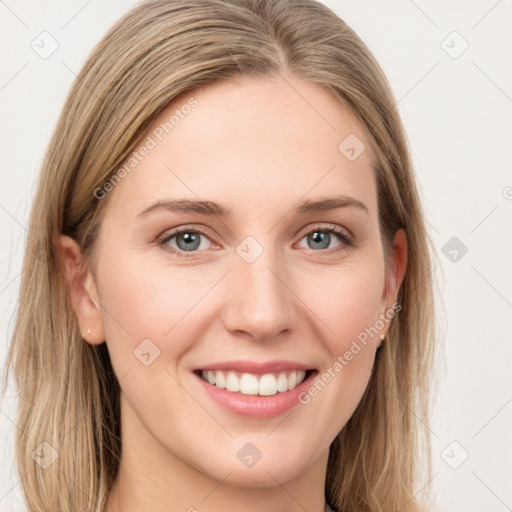 Joyful white young-adult female with long  brown hair and blue eyes