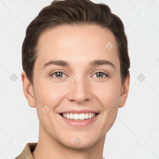 Joyful white young-adult male with short  brown hair and grey eyes