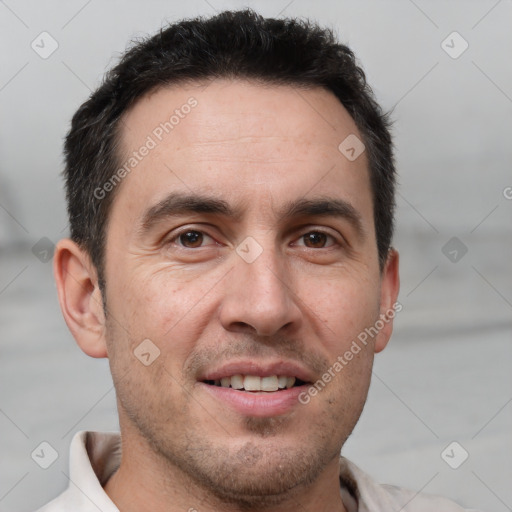 Joyful white adult male with short  brown hair and brown eyes