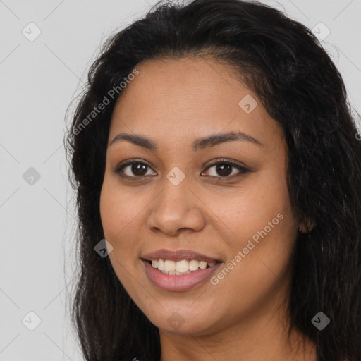 Joyful latino young-adult female with long  brown hair and brown eyes