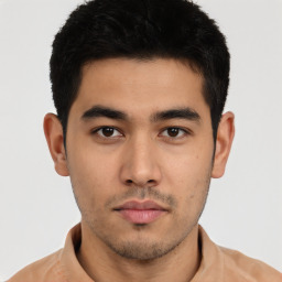 Neutral asian young-adult male with short  brown hair and brown eyes