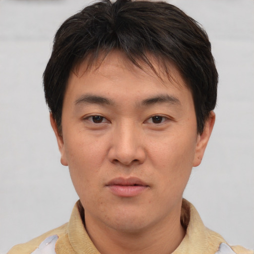 Neutral asian young-adult male with short  brown hair and brown eyes