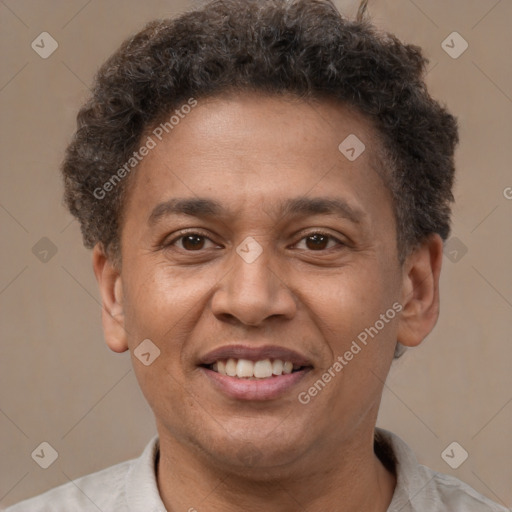 Joyful latino adult male with short  brown hair and brown eyes