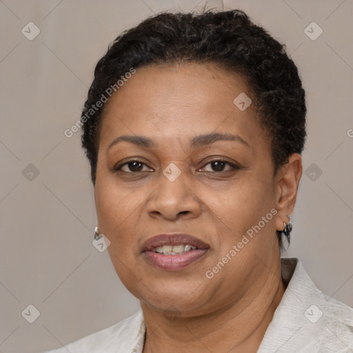 Joyful black adult female with short  brown hair and brown eyes