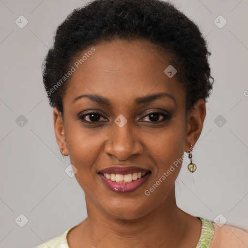 Joyful black young-adult female with short  black hair and brown eyes