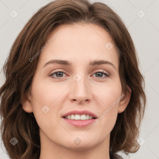 Joyful white young-adult female with long  brown hair and green eyes