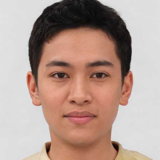 Joyful asian young-adult male with short  brown hair and brown eyes
