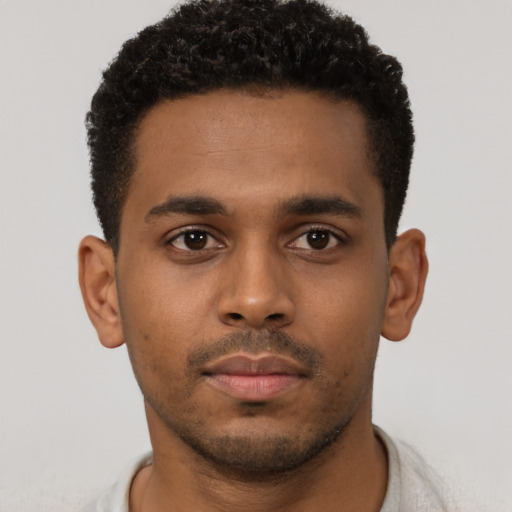 Neutral black young-adult male with short  brown hair and brown eyes