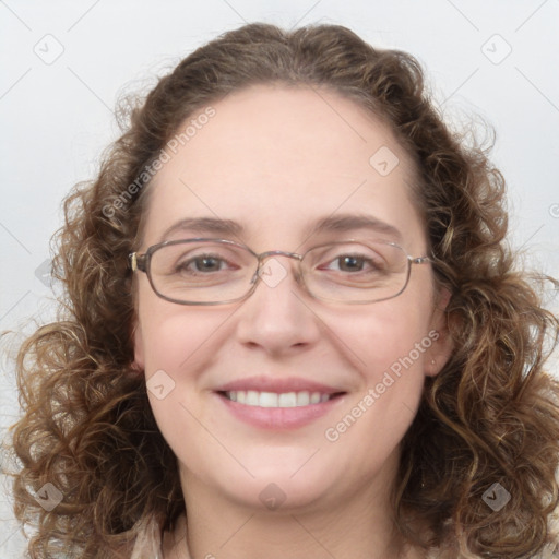 Joyful white adult female with medium  brown hair and blue eyes