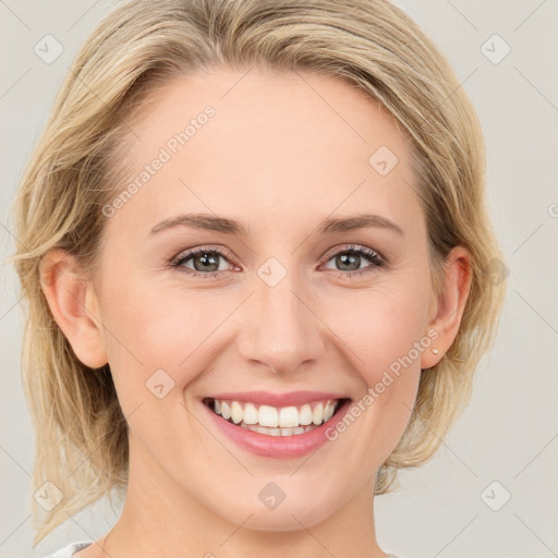 Joyful white young-adult female with medium  brown hair and blue eyes