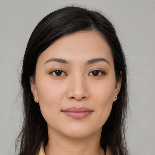 Joyful white young-adult female with long  brown hair and brown eyes