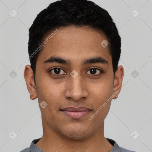 Joyful latino young-adult male with short  black hair and brown eyes