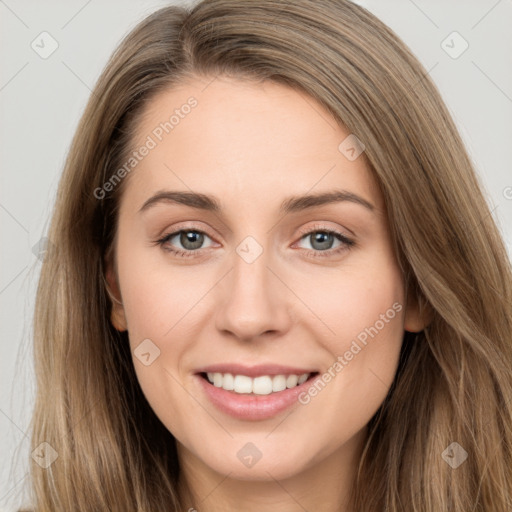 Joyful white young-adult female with long  brown hair and grey eyes