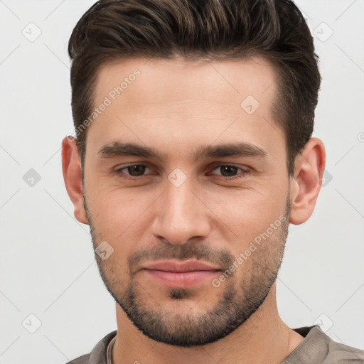 Joyful white young-adult male with short  brown hair and brown eyes