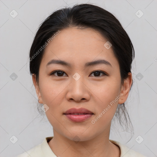 Joyful asian young-adult female with medium  brown hair and brown eyes