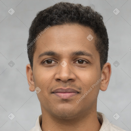 Joyful latino young-adult male with short  brown hair and brown eyes