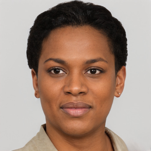Joyful black young-adult female with short  black hair and brown eyes