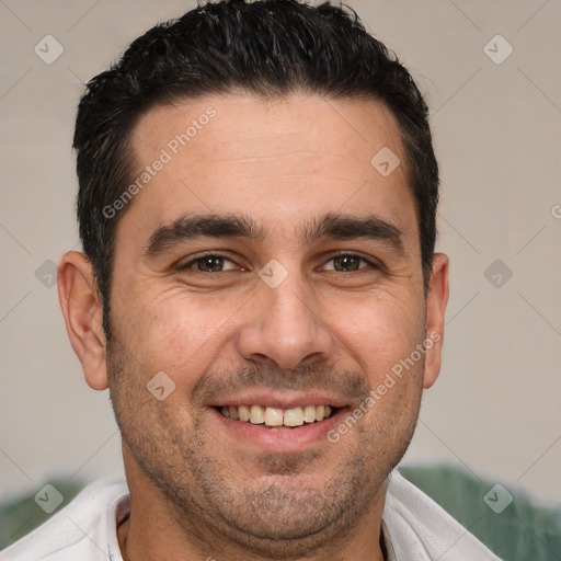 Joyful white adult male with short  brown hair and brown eyes